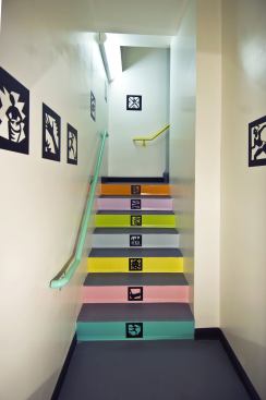 The bright stairwells feature doors made of fire-rated glass instead of steel to let in light and entice occupants to forgo the elevator.