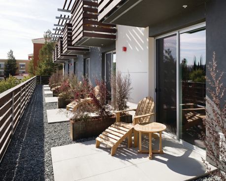 The stacked flats are built at 63 units to the acre, yet a sense of dignity is evident throughout.