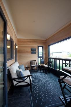 To create a year-round outdoor space, the team designed a transformable porch and placed a 7-foot-by-12-foot motorized window on the front elevation.