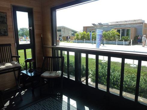 When the window is lowered it acts as a railing and opens the space to pleasant breezes. In the winter it’s warmed by the sun and helps passively heat the space.