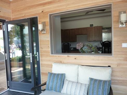 An interior window also fully retracts into the living room wall to give the interior a physical as well as visual connection to the outside.
