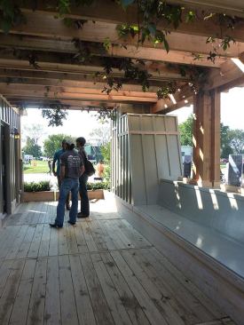 A shallow wrap-around veranda helps shade the four-season porch and links it to the rear deck.