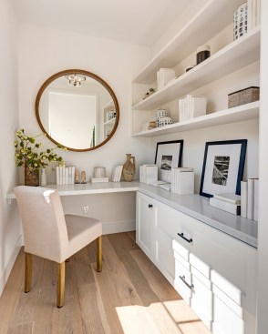This right-sized home office by Thomas James Homes in Los Angeles features cabinet storage, ample counter space, and open shelving.