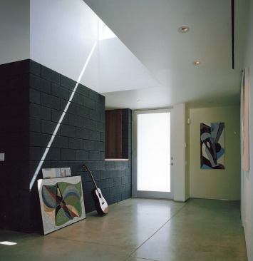 The pass-through looks from the kitchen across the entry foyer into the guest wing. That way, “Grandma can keep an eye on the grandkids,” he says.