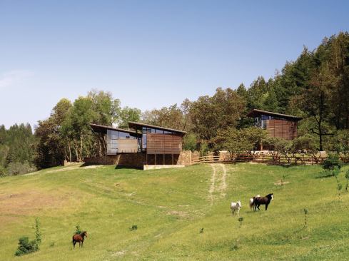 The compound’s four loosely connected buildings share a strong family resemblance.