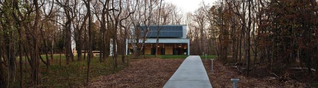 The building was placed facing directly south to maximize solar heat gain in the winter and to maximize power production from photovoltaic panels.