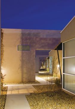 The units are oriented toward pedestrian walkways, rather than toward parking areas.

