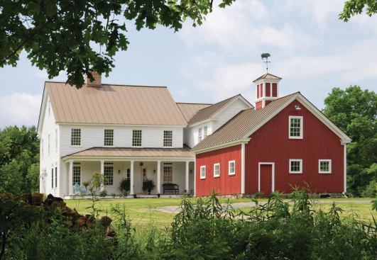 Modeling the additive evolution of the archetypal New England farmhouse, this new house incorporates contemporary features such as solar-thermal and photovoltaic panels, reclaimed materials, and an ICF foundation.