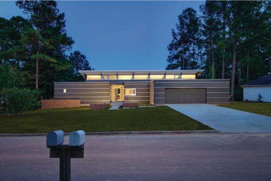 Located on a reclaimed lakefront site, the Smart residence controls natural lighting by means of a large clerestory with a hat bill overhang.

