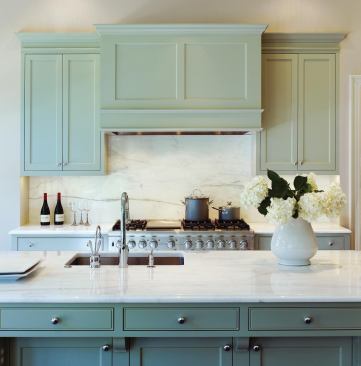This Washington, D.C., kitchen's marble-topped island can serve as a food prep surface, a casual dining area, or both.