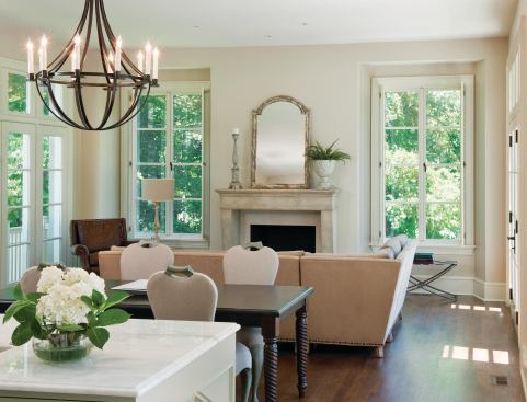 Windows along the adjoining dining and living areas serve to naturally light the kitchen.