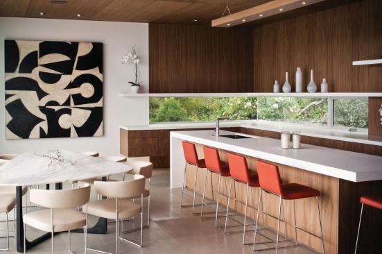 A band of glazing at counter height lights the work surface without inviting scrutiny from passersby.