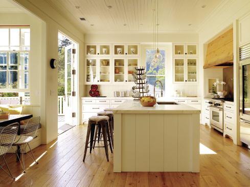 The kitchen's wood-paneled walls and ceiling lend a casual atmosphere.