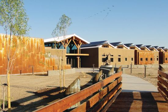 To capitalize on views, Catalyst Architecture oriented the San Luis National Wildlife Refuge Complex on a north–south axis, but limited glazing on the longer elevations.
