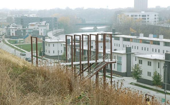 Milwaukee’s Beerline neighborhood, lined with breweries in the 1950s, is enjoying a renaissance. The 20 townhouses at River Homes (top) sold out before construction even began.Vetter Denk’s sculptural Booth Street Stairs (above) connect River Homes with an existing neighborhood up the hill.