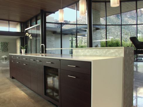 The home measures 6000 square feet, so there's plenty of room for floor-to-ceiling glass that embraces the views, as well as high-functioning undercounter storage. 