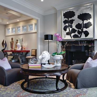 The formal living room is cozy and eclectic.