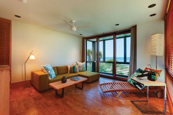 Interiors are simple, almost nautical, as though you were on a cruise ship with a balcony overlooking the beach.