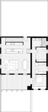 Making the most of a little square footage, Gurney laid out the long, narrow kitchen at the end of the open space, leaving plenty of room for mingling between the island and living room furniture.