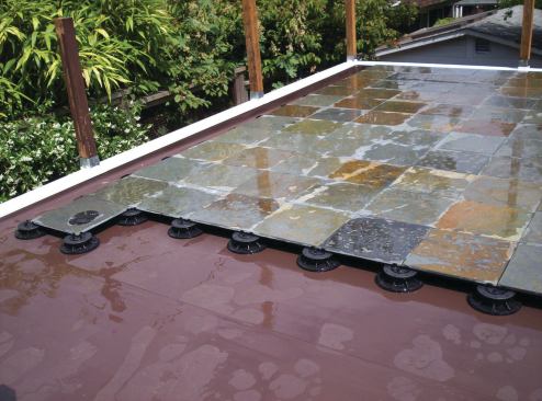 RAIN COAT: Designed specifically for paver or duckboard decking, the Ultra Plazadek waterproof membrane provides 60 mil protection from water. The PVC roofing membrane, which includes a 10-year warranty on waterproofing, requires a trained installer. Duradek. 800-338-3568. www.duradek.com. Booth no. W6576.