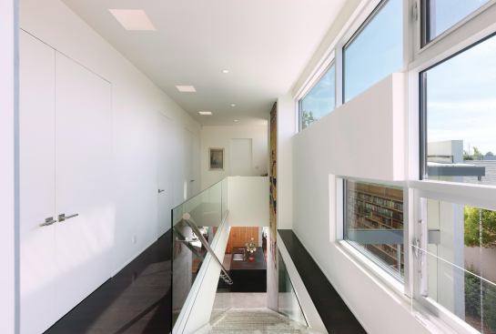 The neutral palette extends to the upstairs hallway.  