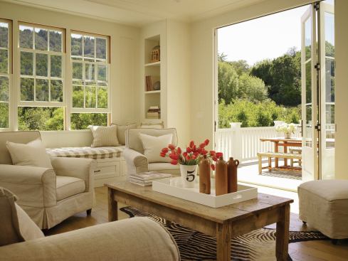 The family room opens onto the rear deck and treetop views.

