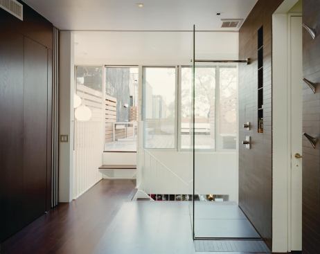 Light and views pass through the bedroom’s transparent shower