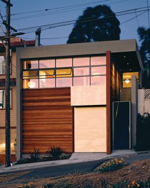 The 1,650-square-foot remodel opens up the original 1950s developer box with a mix of glass and wood.

