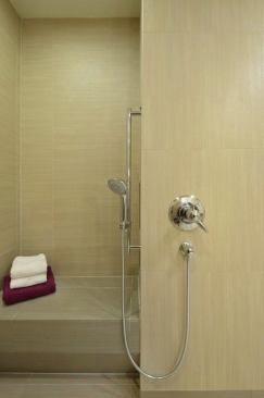 The shower fixture controls are accessible from wheelchair height. 