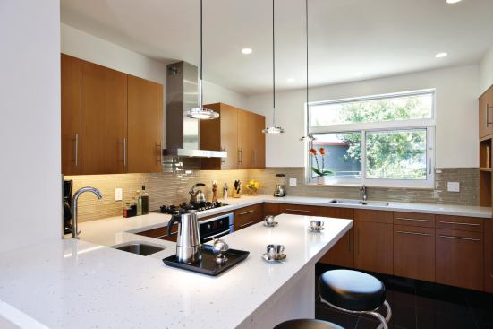 Custom Douglas fir-veneer plywood cabinets warm up the contemporary kitchen, featuring Energy Star appliances from Miele and Bosch and EuroStone quartz countertops. Pendant LED lights are from ET2 Contemporary Lighting. Miele: 800.843.7231. www.mieleusa.com. Bosch: 800.944.2904. www.bosch-home.com. EuroStone: 310.967.8000. www.eurostonequartzcountertops.com. ET2 Contempo-rary Lighting: 800.486.2946. www.et2online.com.