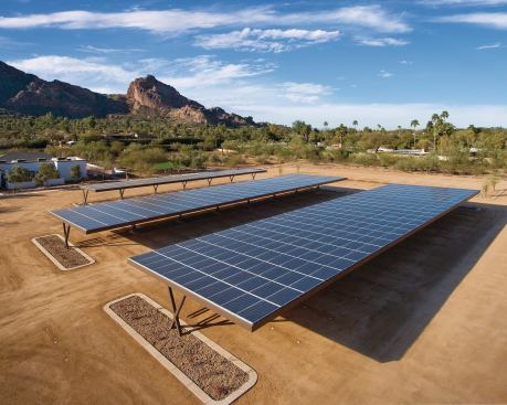 Dual-purpose photovoltaic arrays provide shaded parking while generating free electricity.

Architect: Candelaria Design Associates, Phoenix

