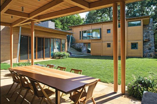 The Hillside House by Gray Organschi is built on a forested slope. 