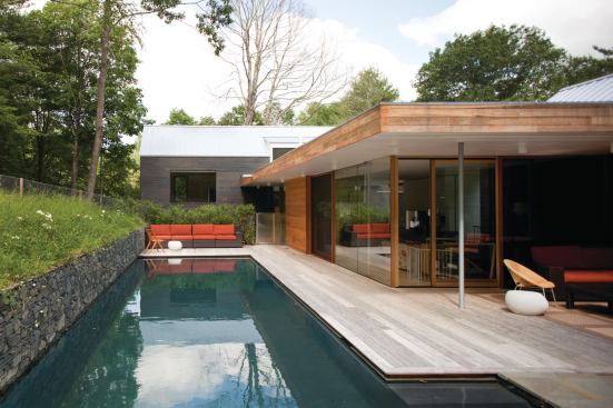 The simple barn forms of the Depot House sit on top of the former train depot’s rubble and cinderblock foundation.