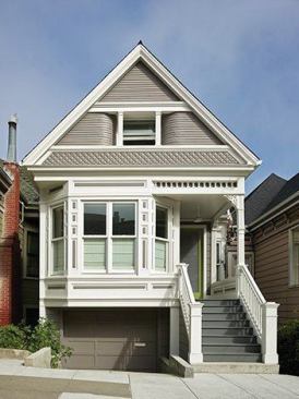 San Francisco architect Jonathan Feldman worked closely with Kyle Mortz from Art of Construction and client/developer Lindsay Chambers to restore this Noe Valley home to its original Victorian state while simultaneously modernizing it. The glass front door lets visitors know that what lies beyond may not be what they expect. 