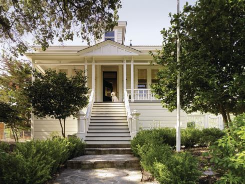The house's picturesque entry elevation is little changed since the Victorian era.

