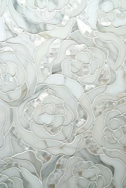 Chrysanthemum, an addition to the Perlamarmi Collection, is designed to add glamour to any home. The mosaic tile forms petals of polished Calacatta Gold marble and white natural rivershell waterjet-cut inserts. Artistic Tile. 212-727-9331. 
www.artistictile.com. 