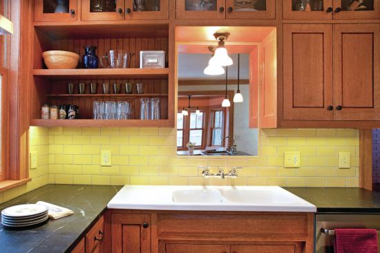 The primary sink is a sink/porcelain drainboard combo that the owners found on a trip to Britain. A mirror above it makes the room feel bigger than it really is. 