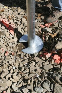 As the driver turns the pile, it simply screws into the ground until the installer is confident it’s below the frostline and in soil with sufficient bearing capacity.