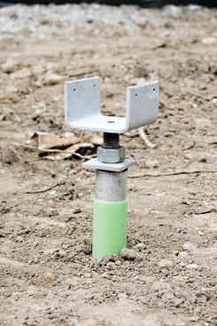 Several types of caps are available to attach piers to framing; some are adjustable in order to fine-tune the elevation.