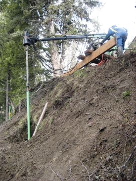 Adding a vertical extension to the drilling rig makes it possible to drive piers into steeply sloped sites.