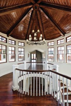 A tongue-and-groove ceiling adds a nautical feel, with curved forms that are like a billowing sail.