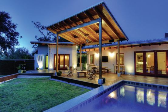 This house has an inside-meets meets-outside flow shown exemplified by its outdoor living space, with a design that’s as simple and striking as it is utility-driven. The butterfly roof helps channel the western breeze while offering shelter from sun and rain. During a downpour, the roof directs runoff onto the main roof and into a cistern. 


Power Haus, Sarasota, Fla.  Designer/Builder: Josh Wynne Construction, Sarasota