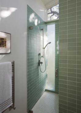 Even the shower is connected to the outdoors. Bath fixtures include a 1.75-gpm shower unit, and Watersense-certified lav faucet and toilet. Locally sourced limestone lines the floor. 