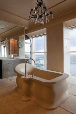 Penthouse master bath. The tub was carved from a single block of stone.

Architect: Webber Studios, Austin, Texas

