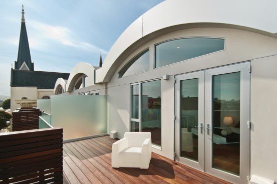 Bedrooms flow onto a private deck.