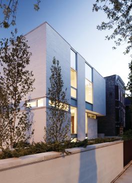 Studio Dwell's Bucktown Three, a custom home in Chicago, presents a reserved facade to the street.