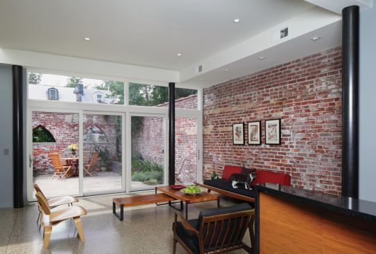The century-old brick walls enclose the first floor as well as a sunny rear garden.