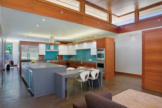 A 2-foot gap between the kitchen walls and ceiling promotes daylighting and natural ventilation.