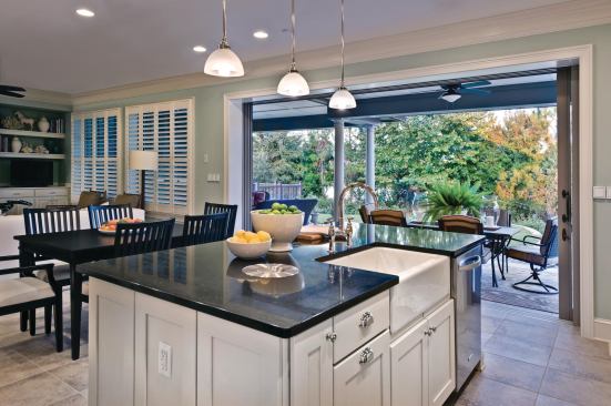 Big Island An island measuring 7 feet 6 inches by 4 feet 6 inches and topped with a Dupont Zodiaq quartz countertop (seen here in "licorice") provides a versatile surface for organizing, baking, food prep, and clean up. In lieu of a garbage disposal, the countertop includes a recessed, compost bin with a bucket handle for transporting vegetable scraps from kitchen to garden.