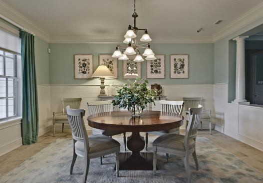 That's Entertainment Many of today's smaller homes deep-six the dining room in the name of downsizing, but the GreenHouse holds fast to this formal space as a staple for entertaining. Its crisp wainscoting is underscored by 18-inch-by-18-inch ceramic floor tiles from Shaw, which extend into the great room and kitchen.